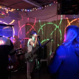 a band performing in a dimly lit room