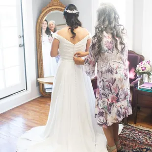 Mom helping me get ready in the bridal suite.