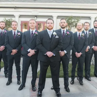 Groomsmen photo in front of the house.
