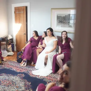 Bridesmaids hanging out in bridal suite before the ceremony.