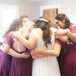 Group hug with the bridesmaids in the bridal suite.