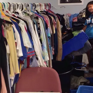 Sorting through clothes in the basement