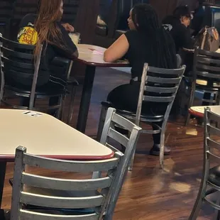 Waitress sitting down.. ( but they short staffed)