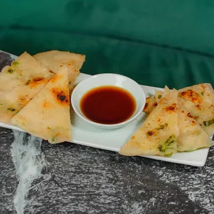 Crispy pan-fried scallion-flavored pancake,  served with house sauce.