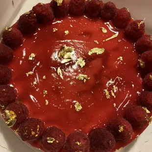 Raspberry Cheesecake with a pop of edible gold flakes