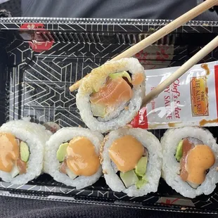 Spicy Salmon Roll (8 Pieces)  I got too hungry and took a picture after I started eating it because that&apos;s how good it is.