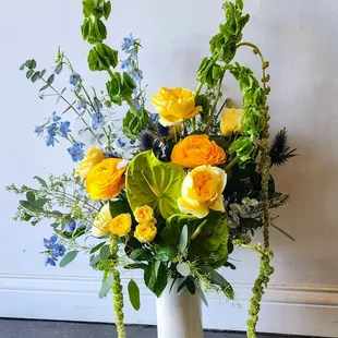 Forge + Bloom is a sophisticated floral arrangement that blends modern elegance with exotic allure.