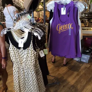 Seasonal rack of dresses and tanks.
