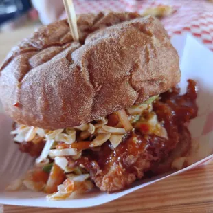 a pulled pork sandwich with cole slaw