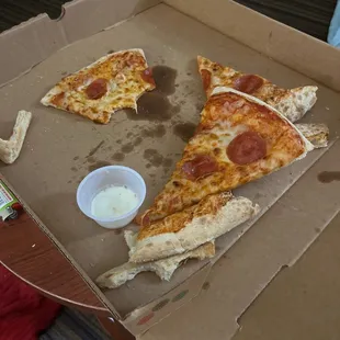 two slices of pizza in a box