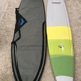 9'-1" Flight Epoxy Longboard and Flight daybag.