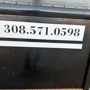 a close up of a sign on the side of a bus