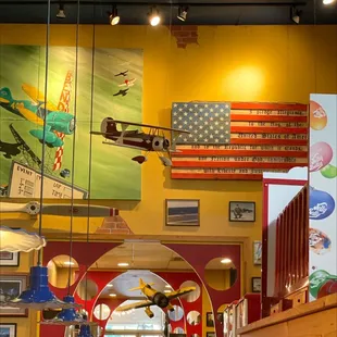 a display of airplanes in the ceiling