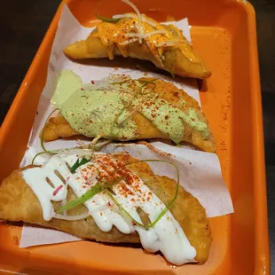 three tasty looking pastries on a tray