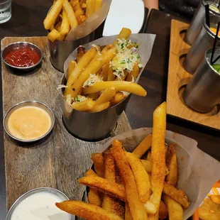 french fries and dipping sauces on a table