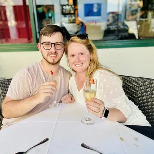 a man and a woman sitting at a table