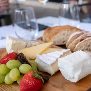 Cheese board sampling w/ fruit &amp; bread.Photo credit  Kate Baumwell