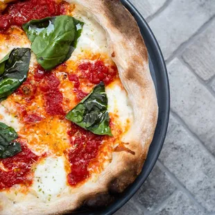 Pizzas wood fired to a crisp perfection.