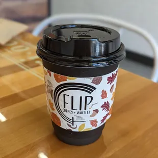 a coffee cup on a table