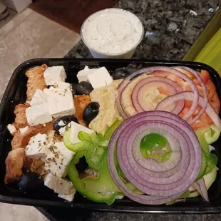 Greek rice bowl with chicken. Their homemade tzatziki sauce is amazing.