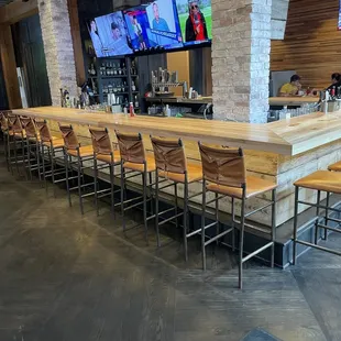 New inside decoration with a bar and tvs.