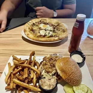 Breakfast pizza and red barn burger with crispy shallots, melted brie, and applewood bacon aioli.