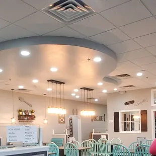 a view of a dining room and kitchen