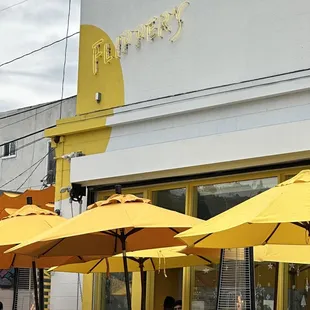 Cute yellow sign and umbrellas :)