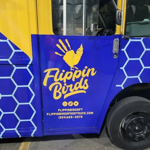 a blue and yellow food truck