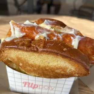 a hot dog in a paper container