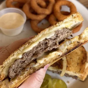 Patty Melt!! 1/4 lb burger on toasted rye with Swiss cheese and grilled onion! So good today! With onion rings!