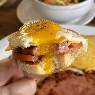 Another sunny side egg on top of English muffin, ham (from ham and eggs plate), sliced tomatoes, and slice of American cheese!
