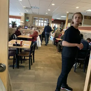 a man standing in a restaurant