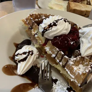 a plate of waffles and ice cream