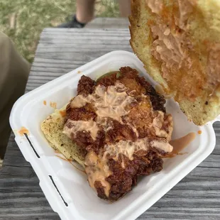 a person holding a piece of food