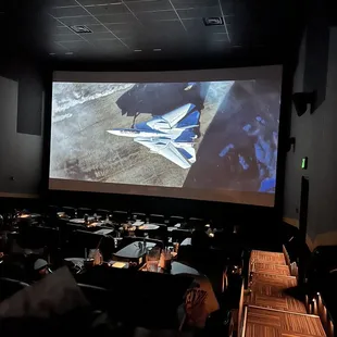 a large screen in a dark room