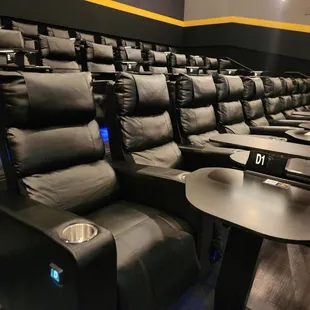 Reclining sofa chairs with adjustable tables