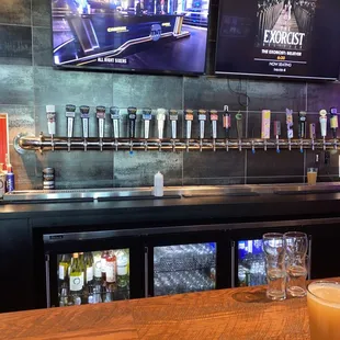 a bar with a large screen tv