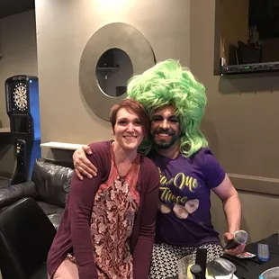 a man and woman with green wigs