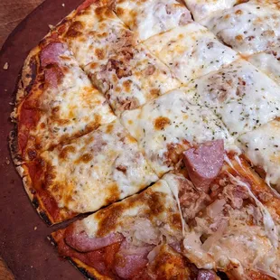 a pizza on a wooden board
