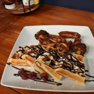 waffles with whipped cream and chocolate sauce