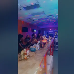 people sitting at the bar