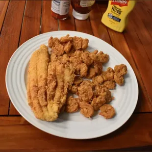 a plate of fried fish