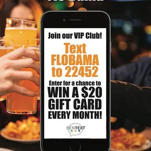 a person holding a glass of beer