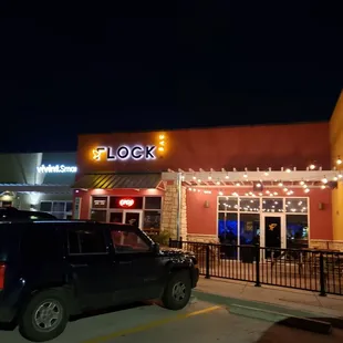 the outside of a restaurant at night