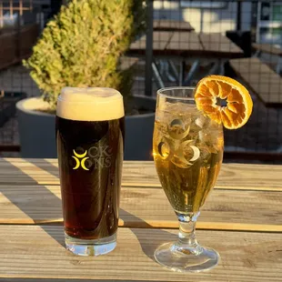 a glass of beer and a glass of orange juice