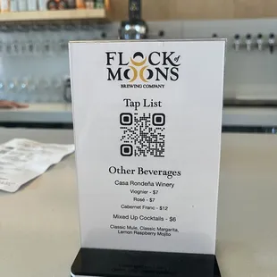 a table with a drink list on it