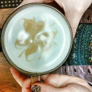 a person holding a cup of coffee