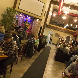 people sitting at tables eating