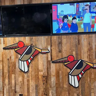 two birds on the wall